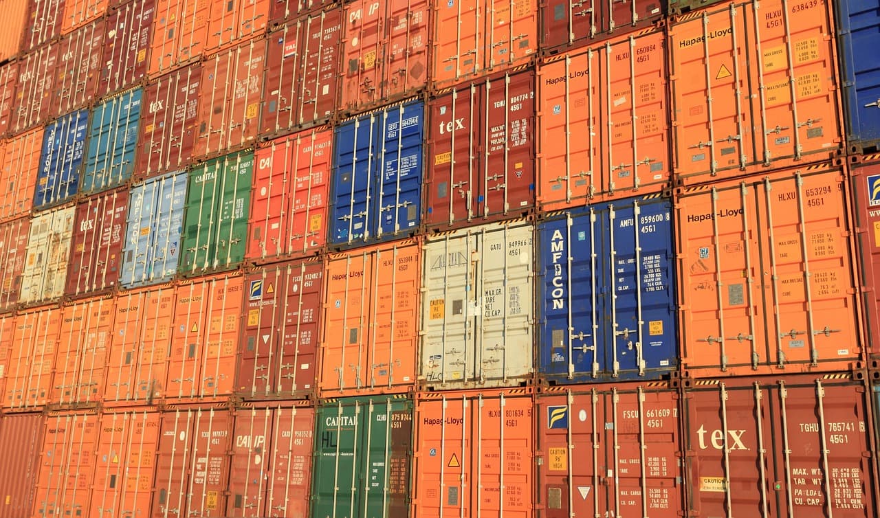 Shipping containers and logistics representing purchase orders and delivery tracking
